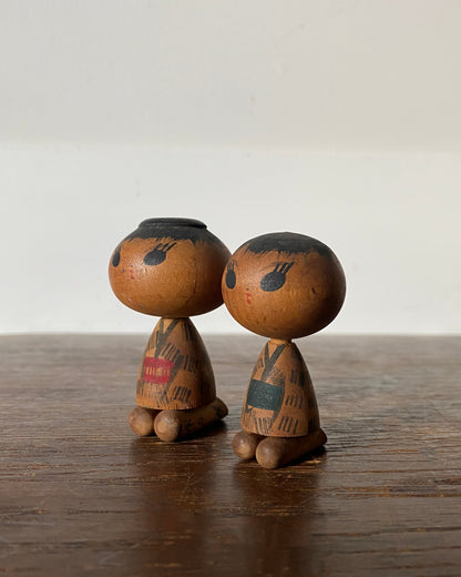 vintage seated kokeshi pair