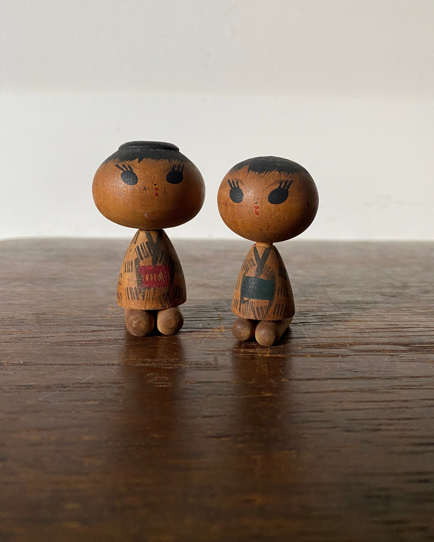 vintage seated kokeshi pair