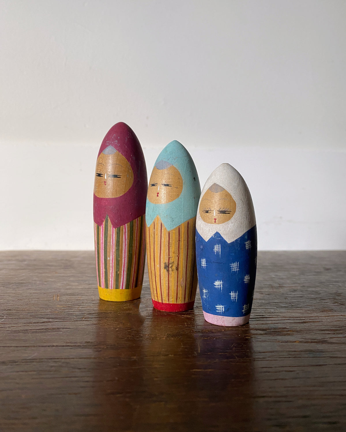 vintage colourful kokeshi trio