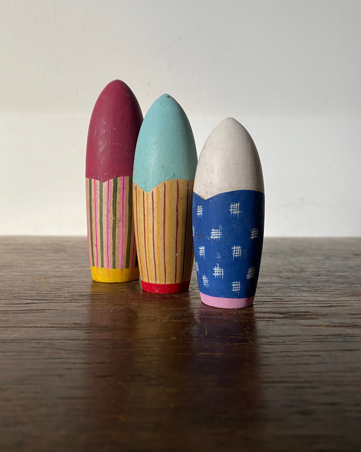vintage colourful kokeshi trio