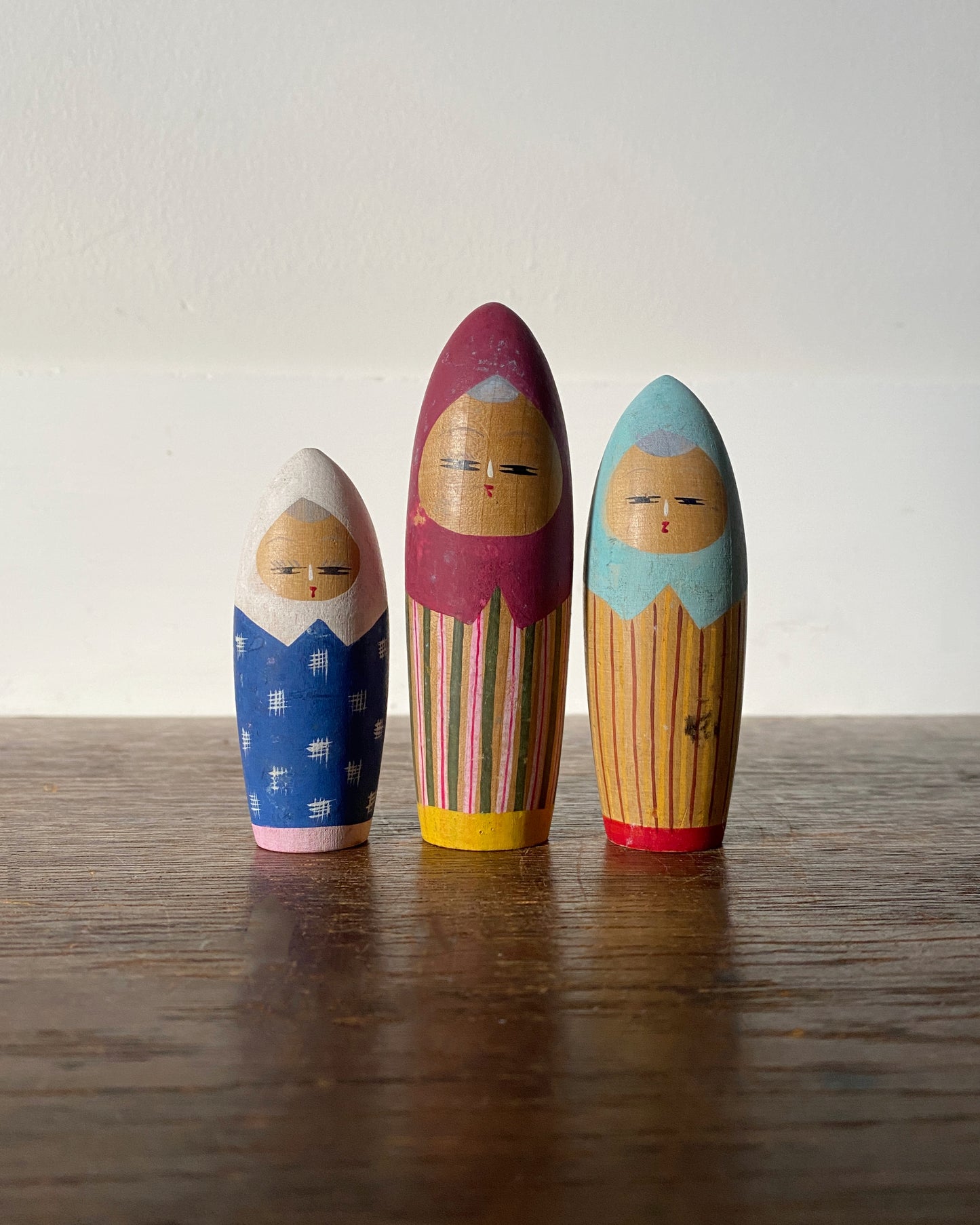 vintage colourful kokeshi trio