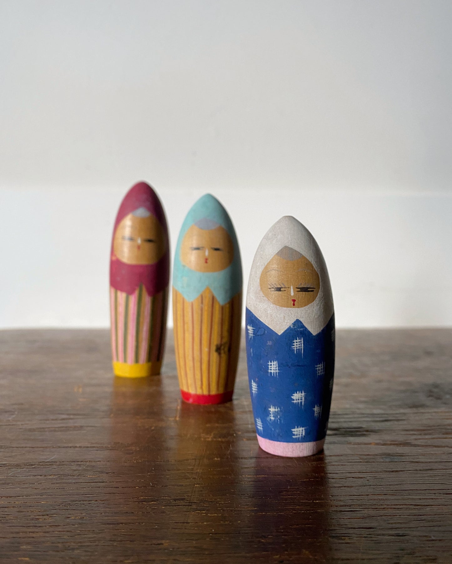 vintage colourful kokeshi trio